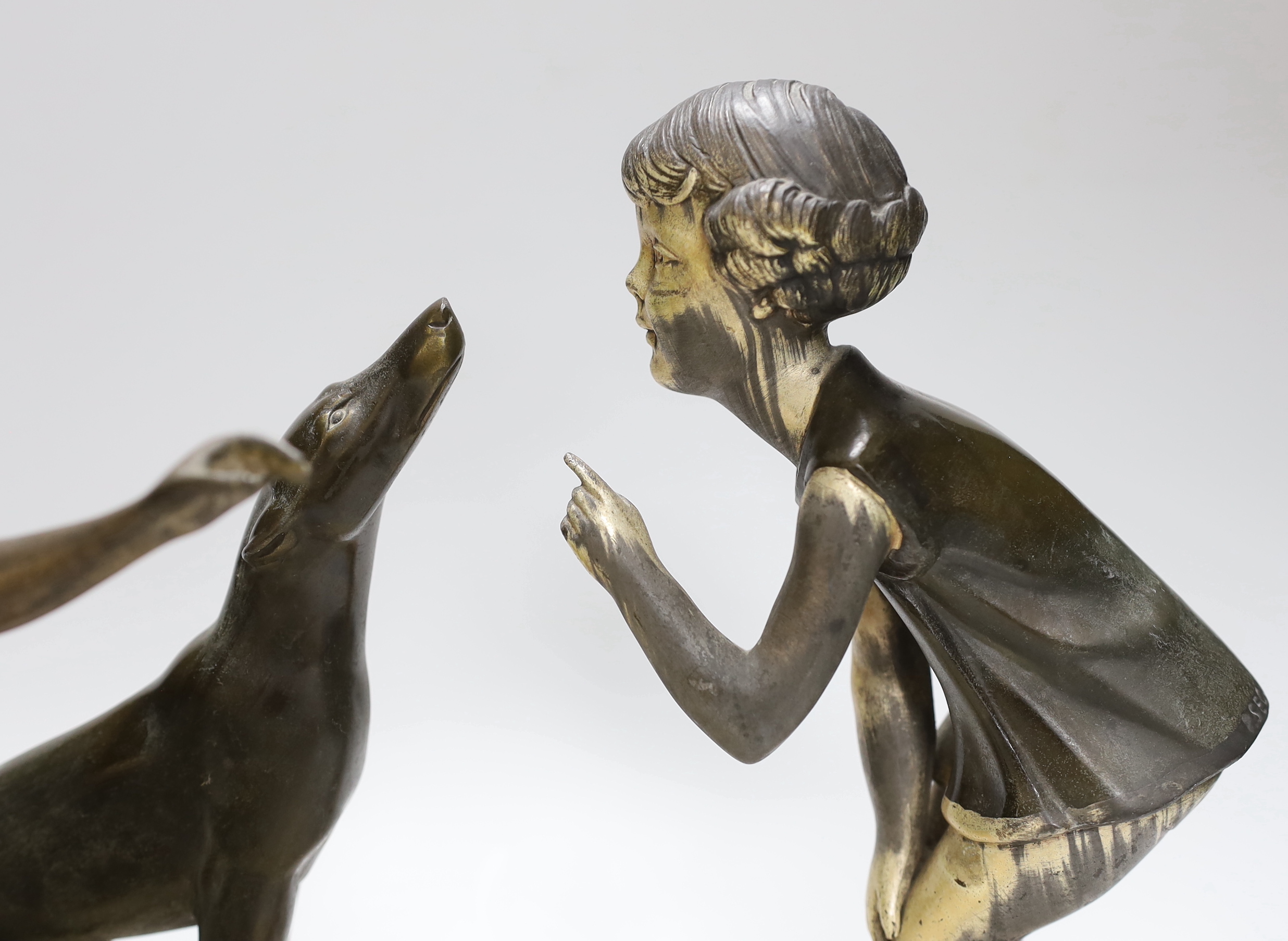 An Art Deco spelter figure of a girl and dog on marble base signed P.Sega, together with a similar Art deco figure of a female dancer on an onyx and red marble base, height 28cm